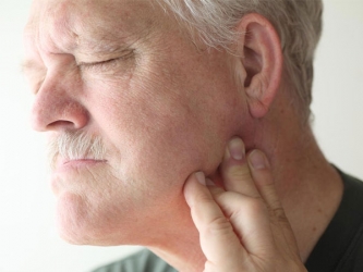 Боли в челюсти – симптомы и причины